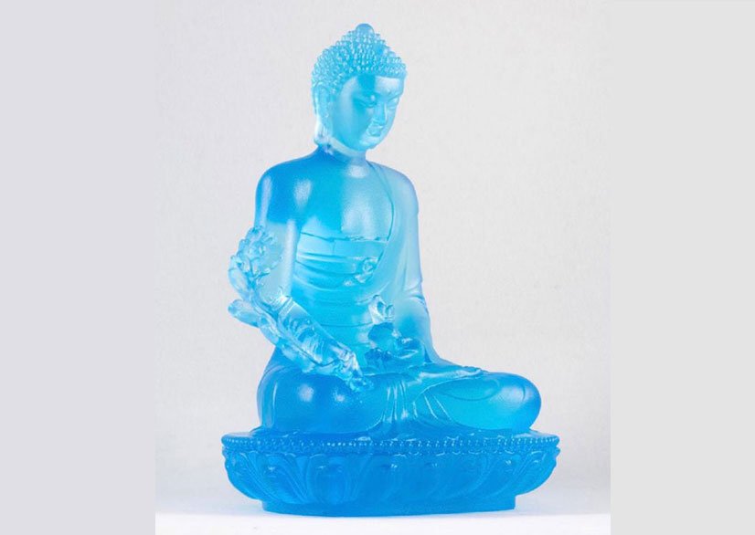 A sky blue Medicine Buddha statue.